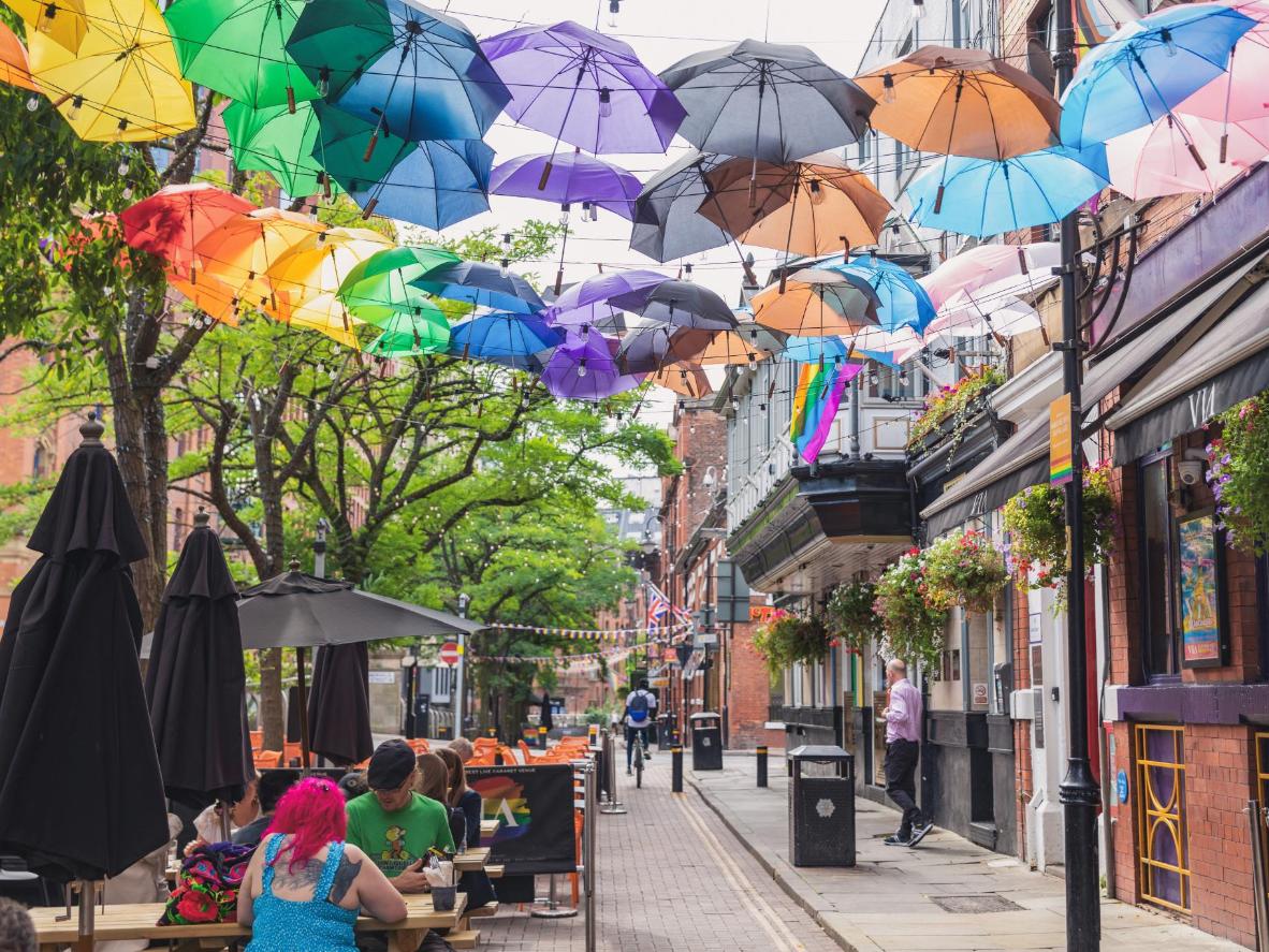 Canal Street comes alive under a kaleidoscope of colourful umbrellas, painting the sky with hues of joy and vibrancy