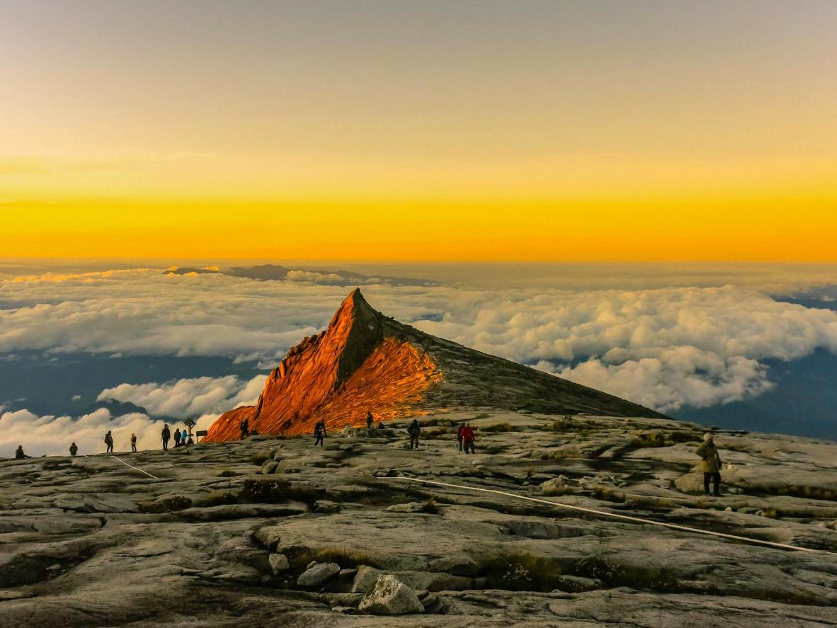 Catch a sunrise over the Nanamun River from the South Peak of Mount Kinabalu