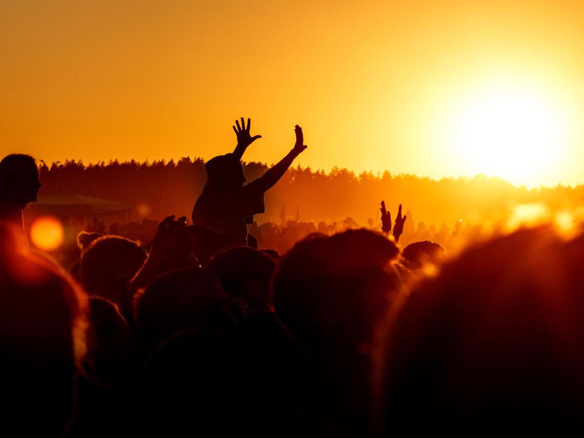 Bask in the magical atmosphere of Wonderfruit Festival as the sun sets over the festival grounds