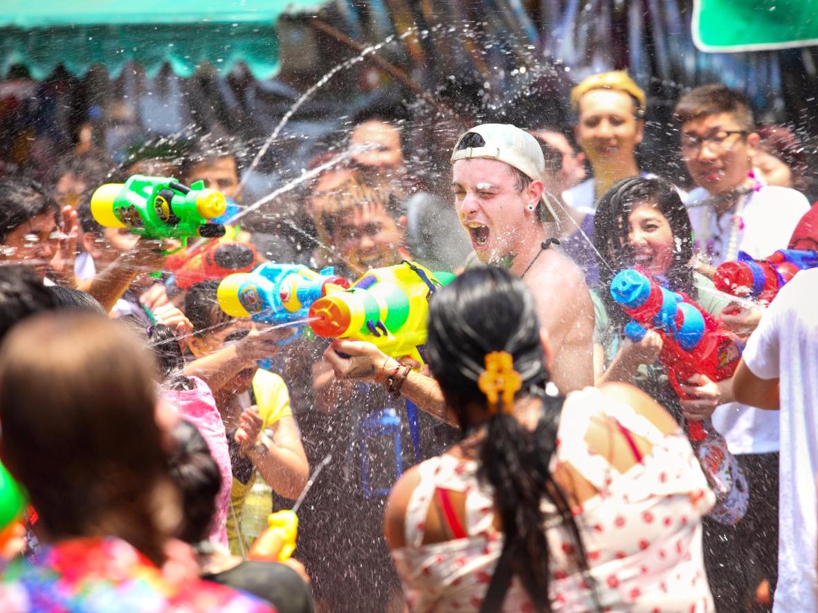 During Songkran, tourists dance to DJs and soak each other along Khao San Road