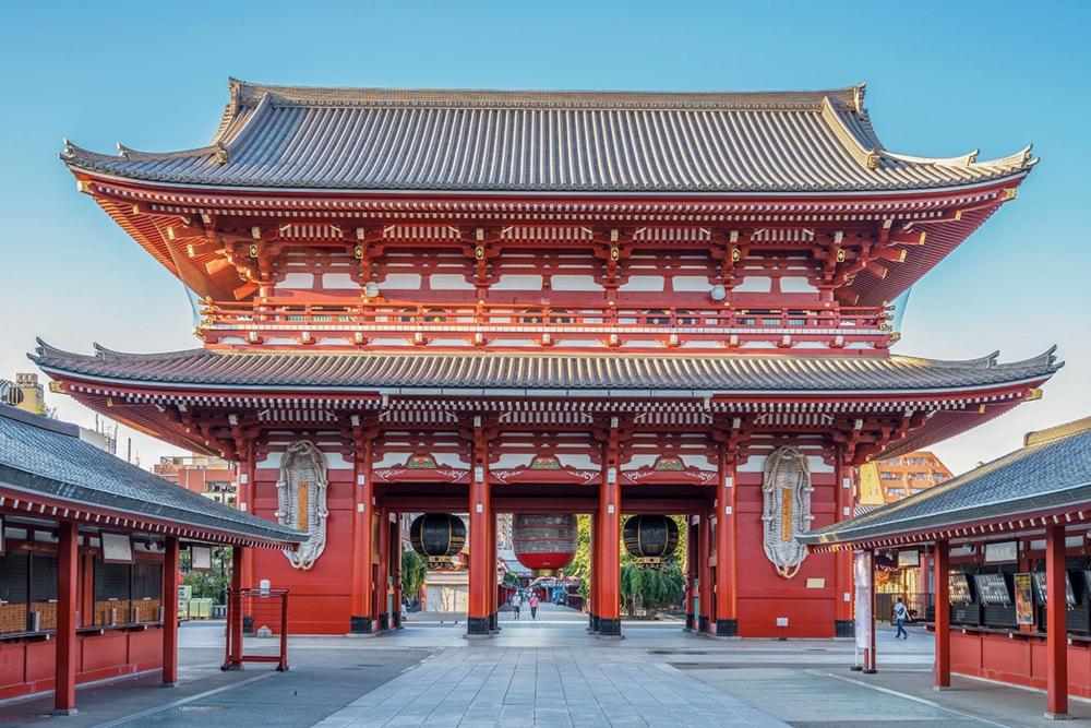 A large red building featuring a prominent archway, highlighting known as Yudonburi Sakaeyu in Asakusa