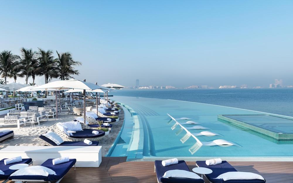 The light-blue waters of the stunning infinity pool at Jumeirah Burj Al Arab Dubai, showcases sleek elegance