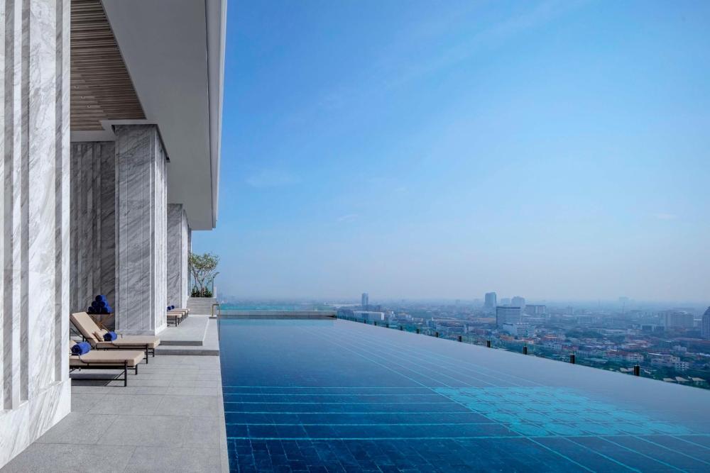 Infinity pool at the penthouse of 137 Pillars Residences, offering stunning views of Bangkok, Thailand