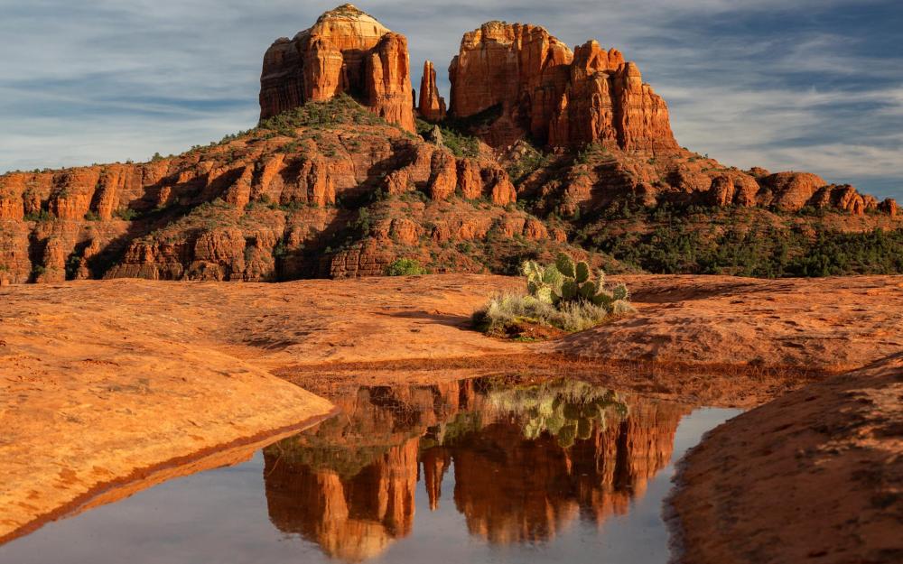 The vibrant hues of red at the Red Rock State Park make for an impressive, vast landscape