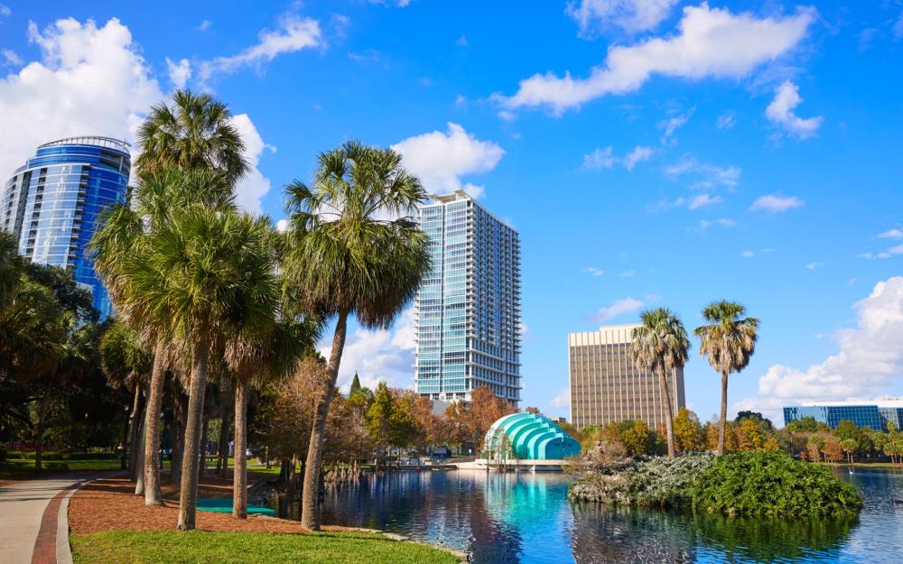 Orlando’s skyline can be seen from Lake Eola amongst some trees