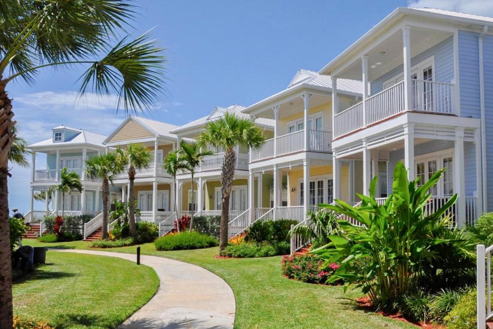 Beachfront homes lined with palm trees at Anglers Reef Getaway, capturing the essence of the Florida Keys in Islamorada.