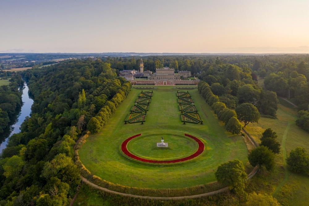 Aerial view of a large circular garden at Cliveden House, showcasing its intricate design and lush greenery.