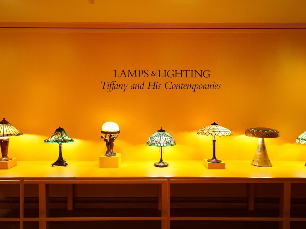 Tiffany and Klein lamps illuminated in the Charles Hosmer Morse Museum of American Art, showcasing intricate designs