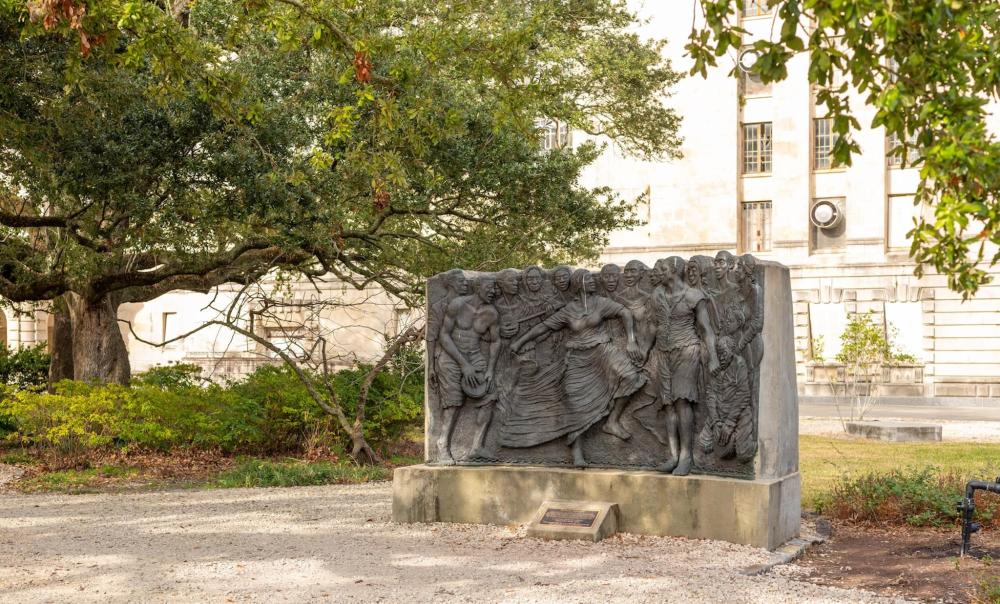 A statue representing a gathering of people in Congo Square, New Orleans, highlighting the area's rich cultural history