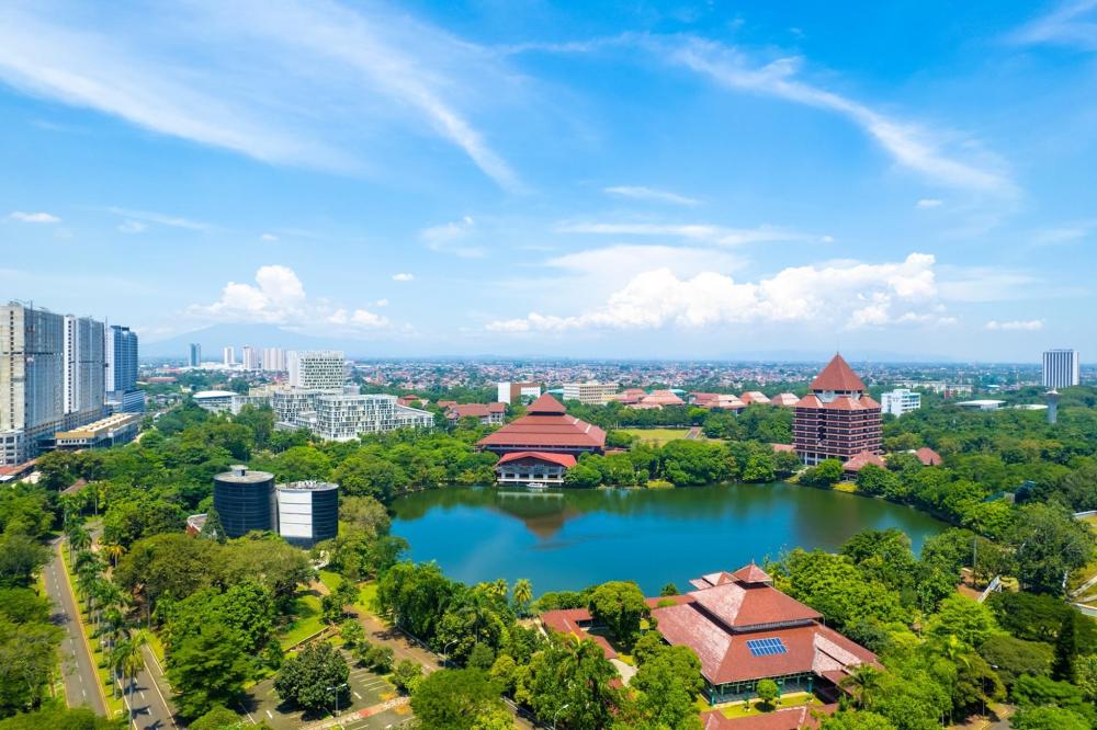 The city skyline featuring modern skyscrapers and urban landscape, with Depok visible in the background