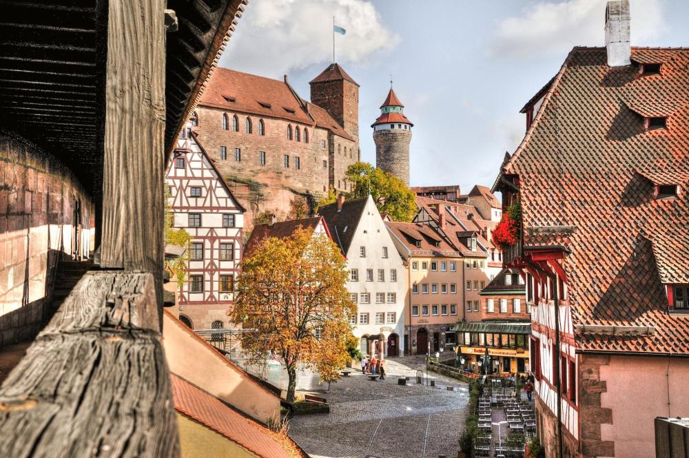 A panoramic view of Nüremberg's cityscape from a balcony – historic buildings are pictured in the background
