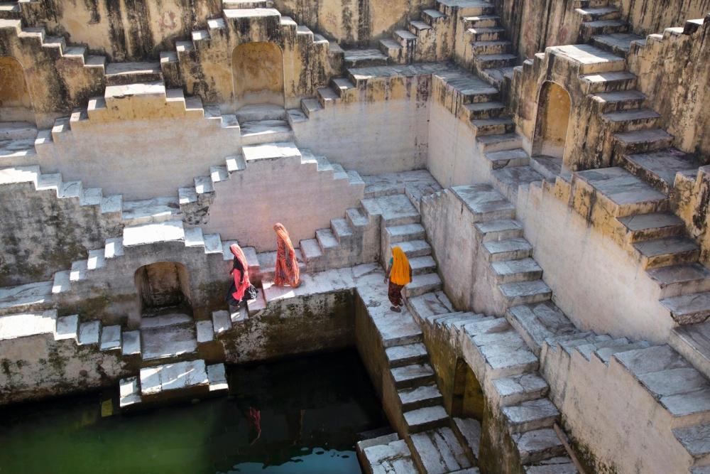 Steps leading to the river in front of Amber Fort, surrounded by scenic views of the water and landscape
