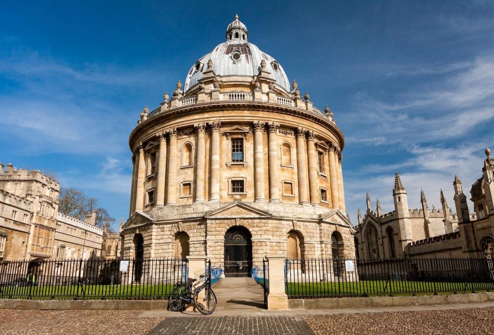 The Radcliffe Camera dome in Oxford, showcasing its distinctive architectural design against a clear blue sky