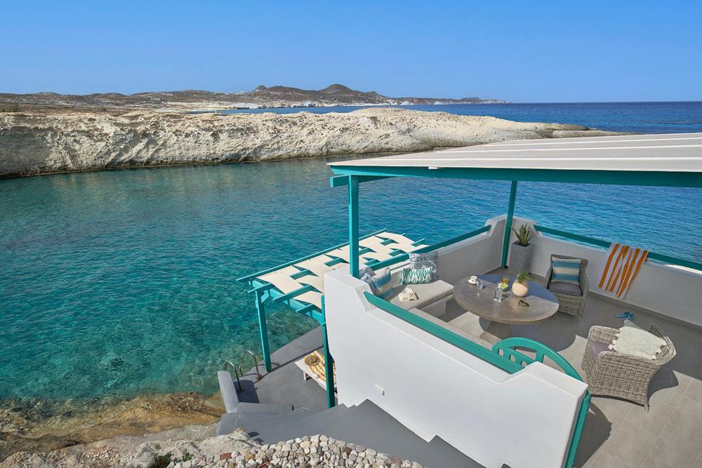 A villa with a stunning view overlooking the ocean, showcasing the beauty of coastal living.