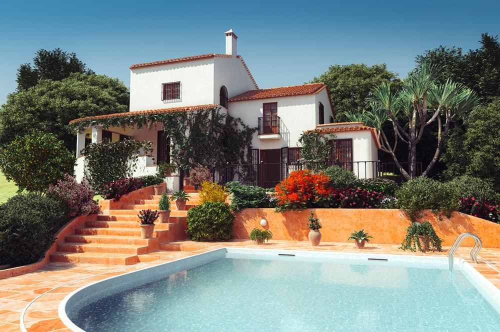 An inviting swimming pool nestled in a stylish villa, featuring sun loungers and lush greenery around it.