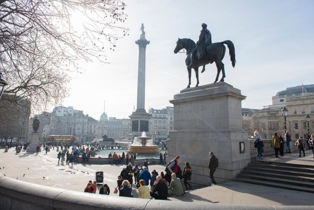 Trafalgar Square in London, featuring Nelson's Column and the Equestrian statue of George IV