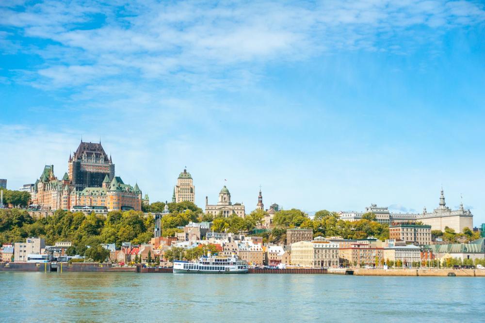 The historic skyline of Quebec City, Canada, prominently featuring the Fairmont Le Château Frontenac overlooking the St. Lawrence