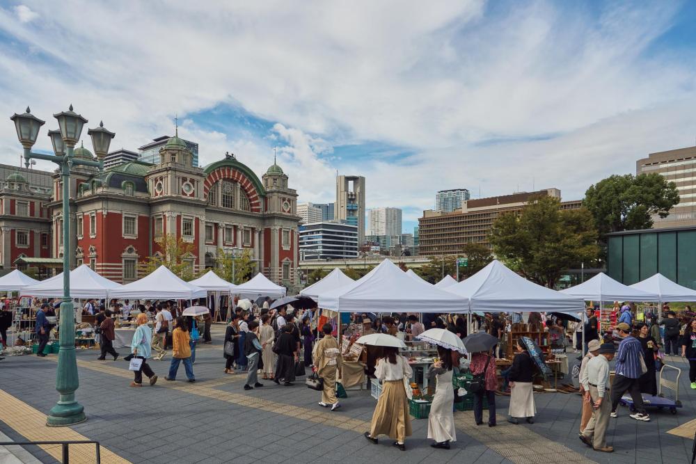 Visitors browsing stalls outside Osaka Central Public Hall