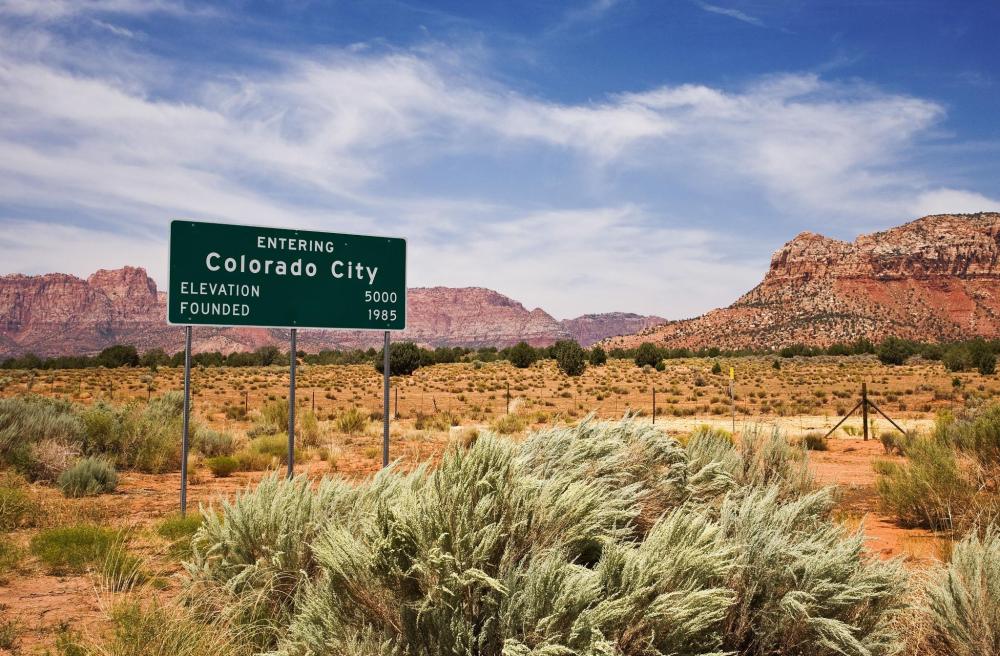 Welcome sign for Colorado City in the Arizona desert.