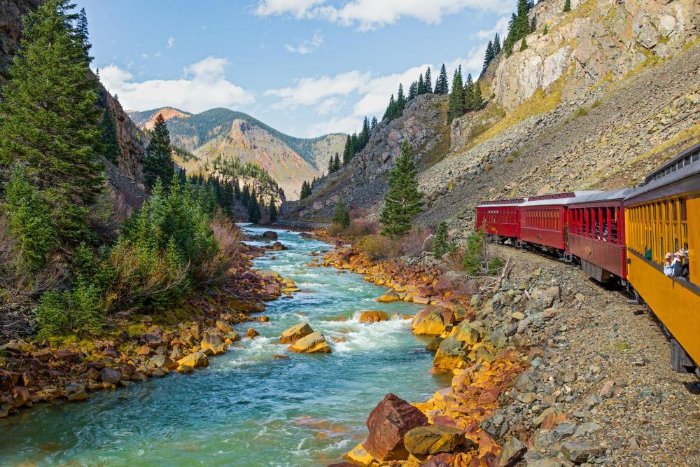 Scenic train traveling through the San Juan Mountains.