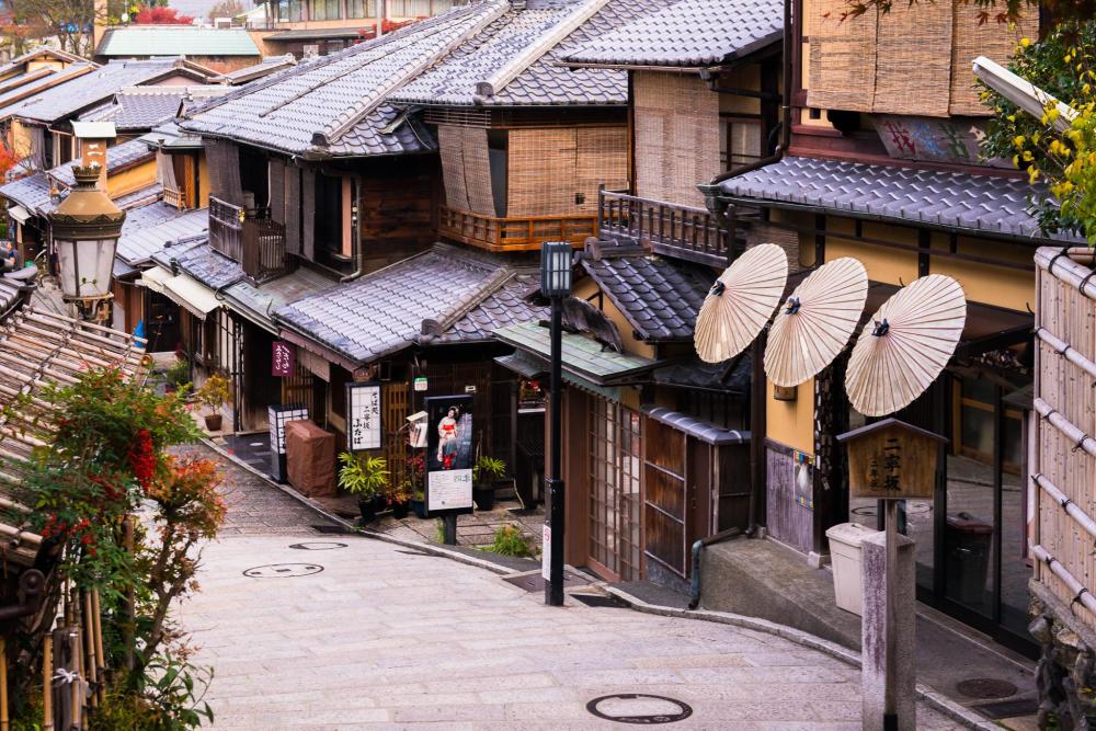 Traditional wooden buildings lining a historic street in Kyoto.
