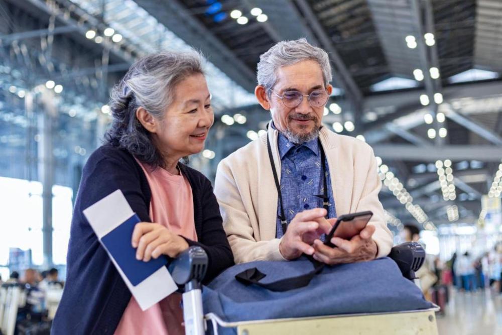 An elderly couple at the airport