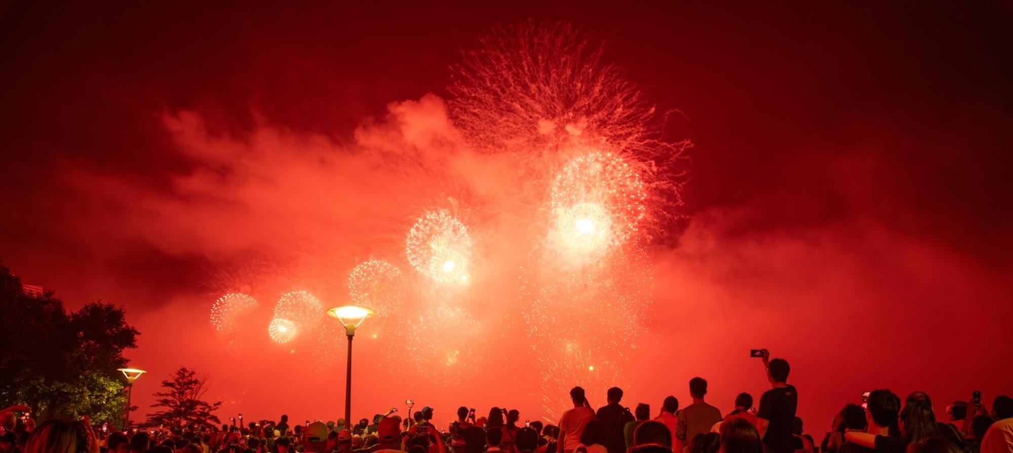 Red fireworks in NOLA's sky for 4th of July celebrations