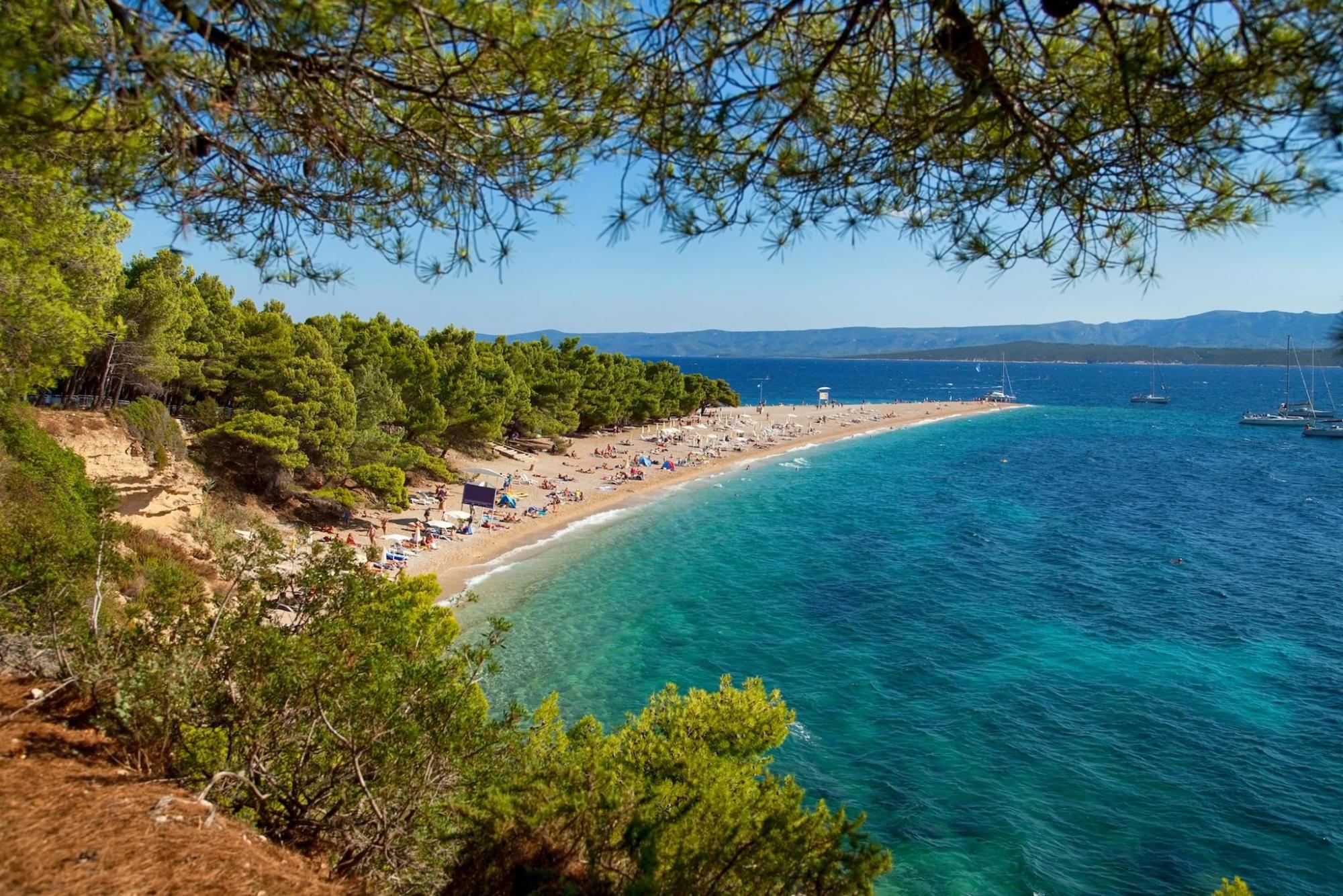 A serene beach in Croatia with vividly blue seas