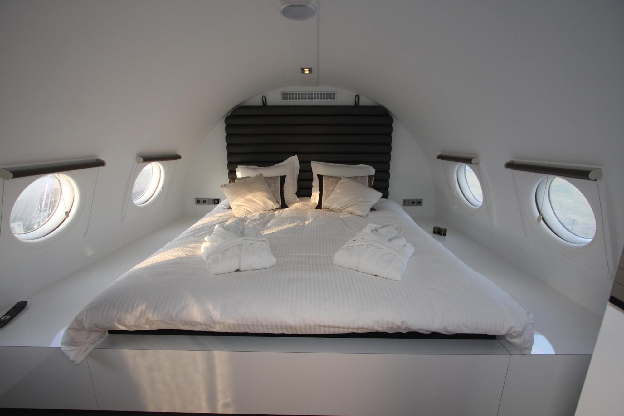 A plane hotel with a double bed inside