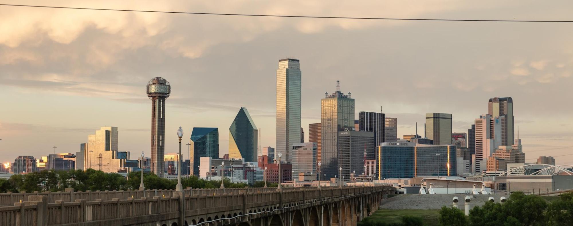 A marmalade hued sunset over Dallas' cityscape