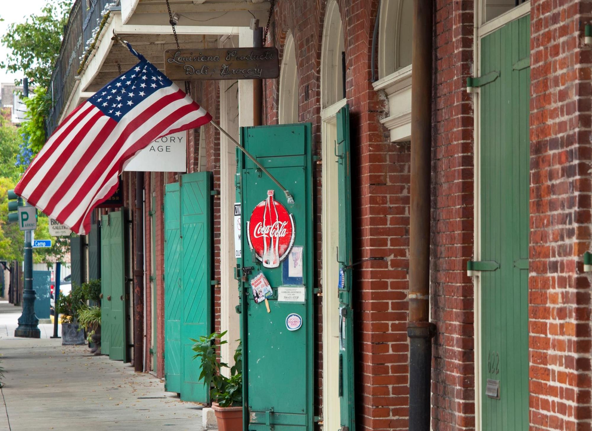 A red brick building with the US flag on Julia Street