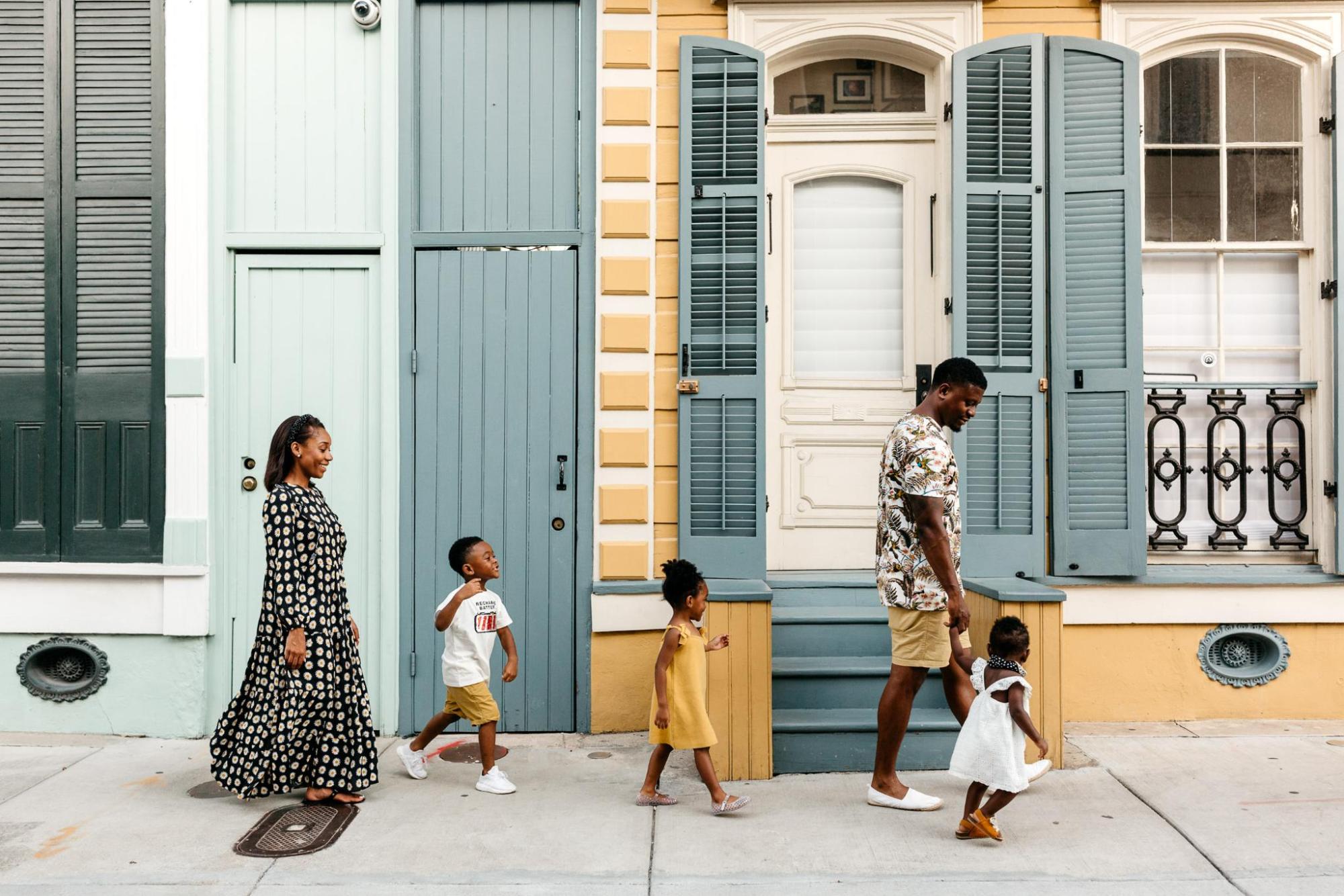 A family strolls down the streets of New Orleans