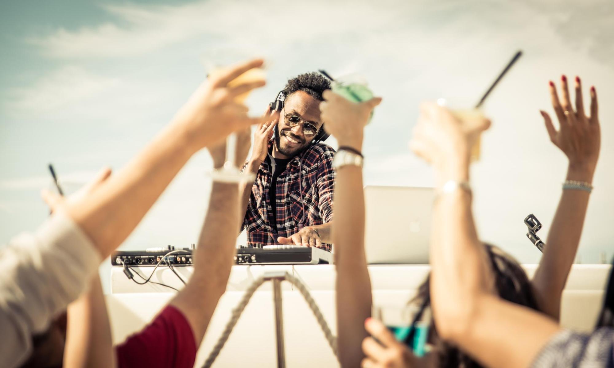 Crowd enjoying a DJ performance at a festival.