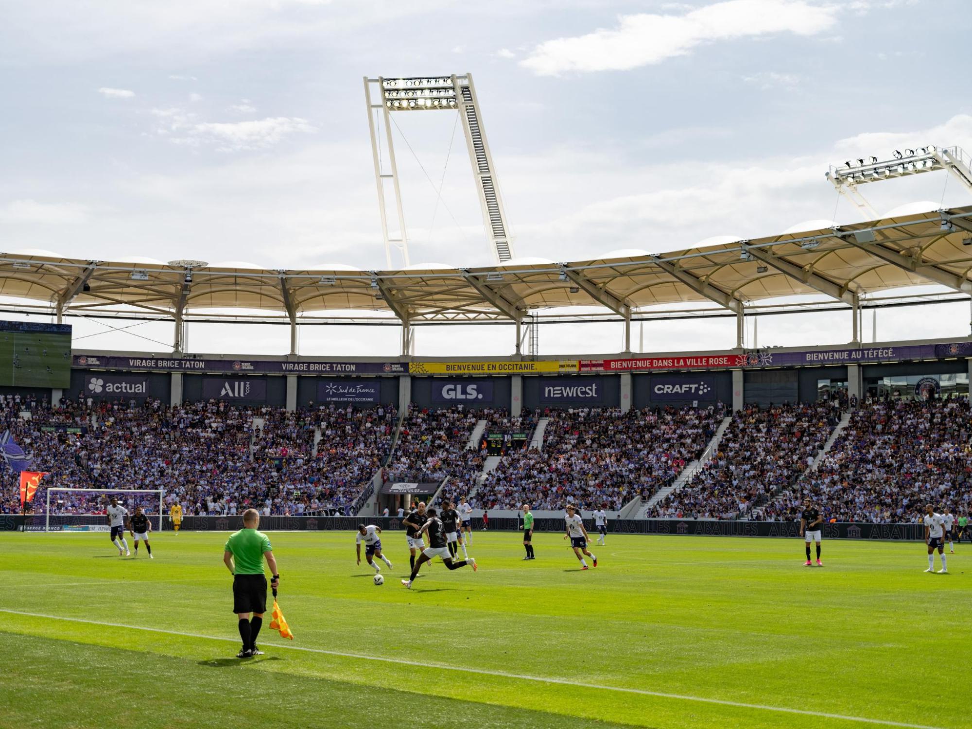 Football field with players engaged in a match.