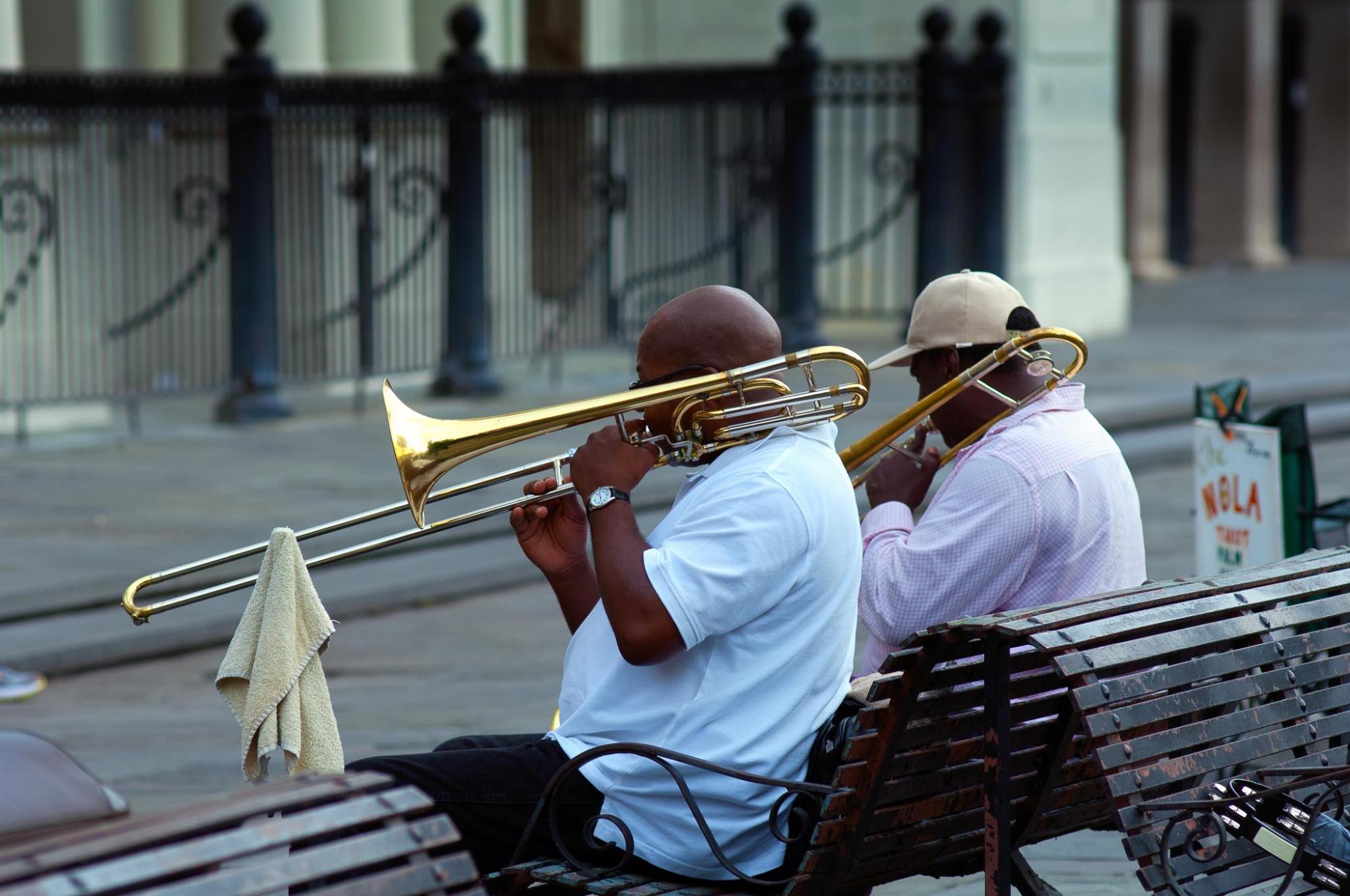 Two men play trumpet in NOLA