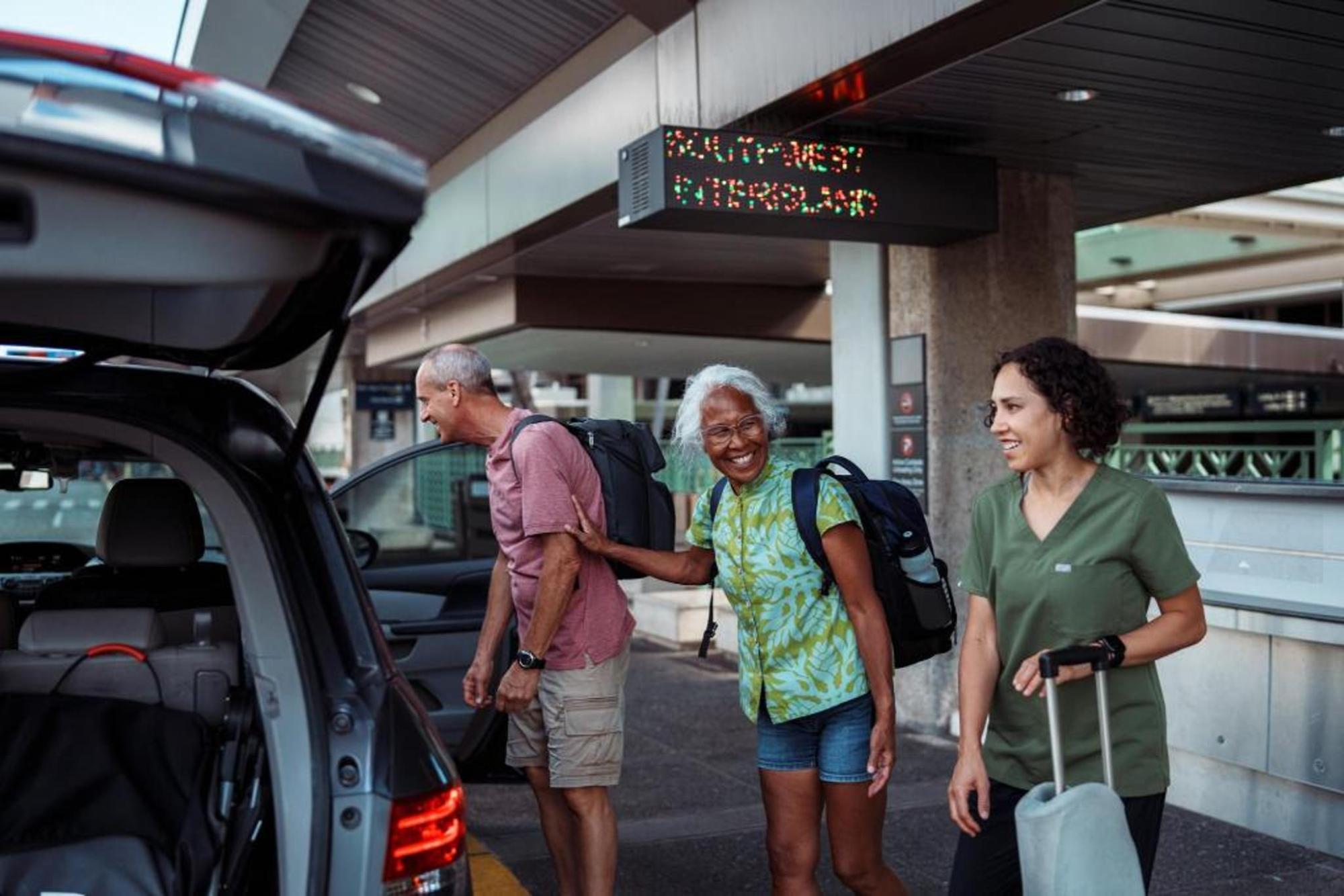 An elderly couple arriving at the airport 