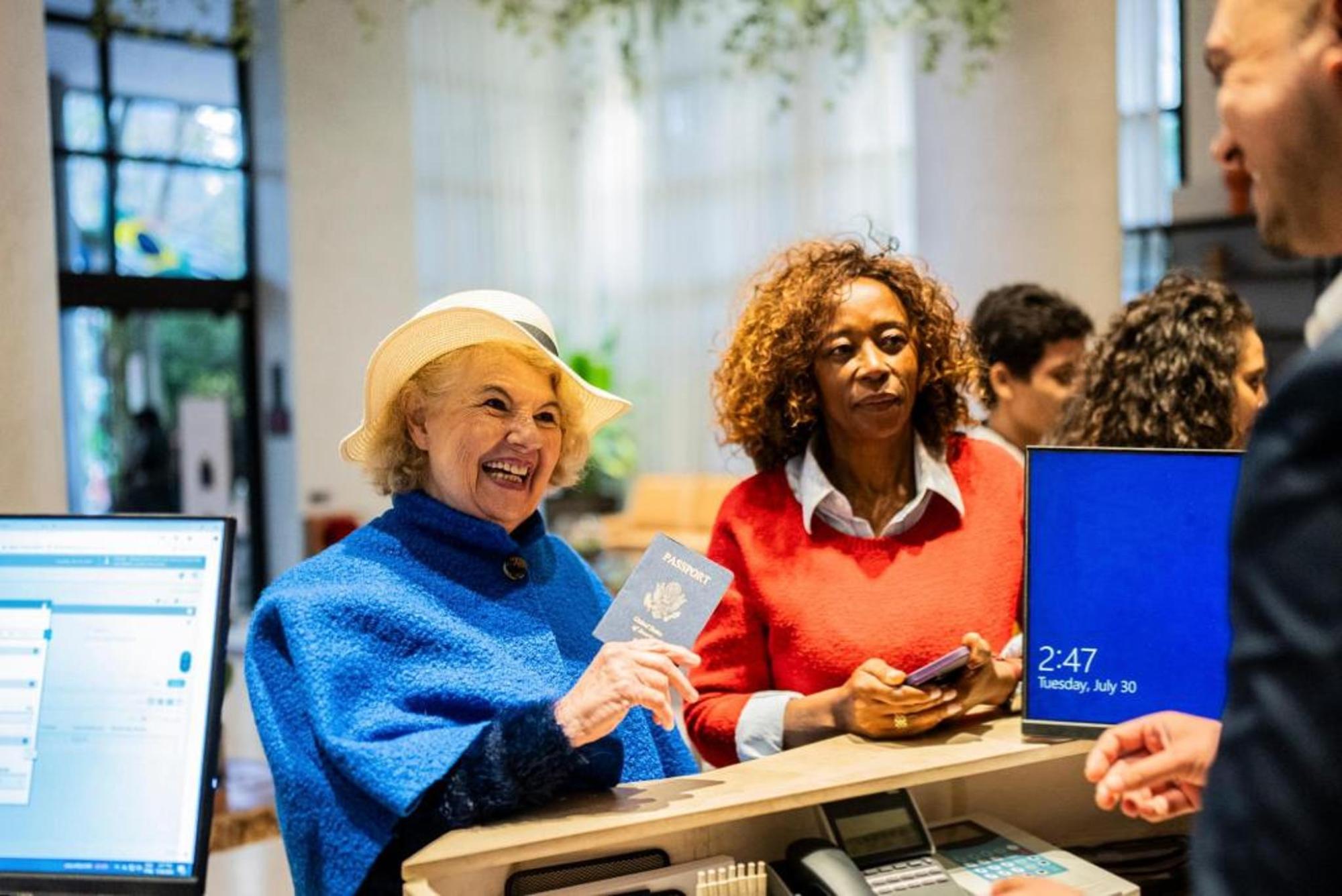 Traveller checking in at a hotel reception desk