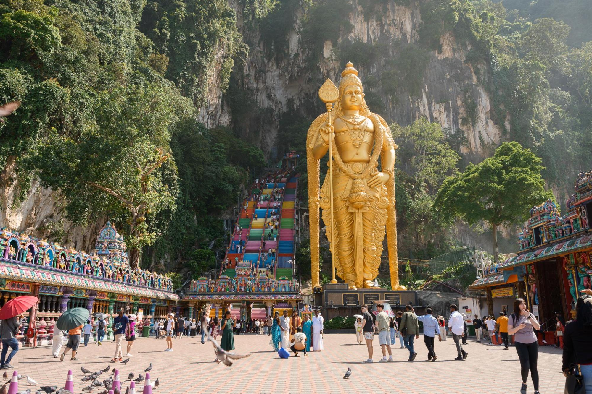 Visitors exploring Batu Caves in Kuala Lumpur