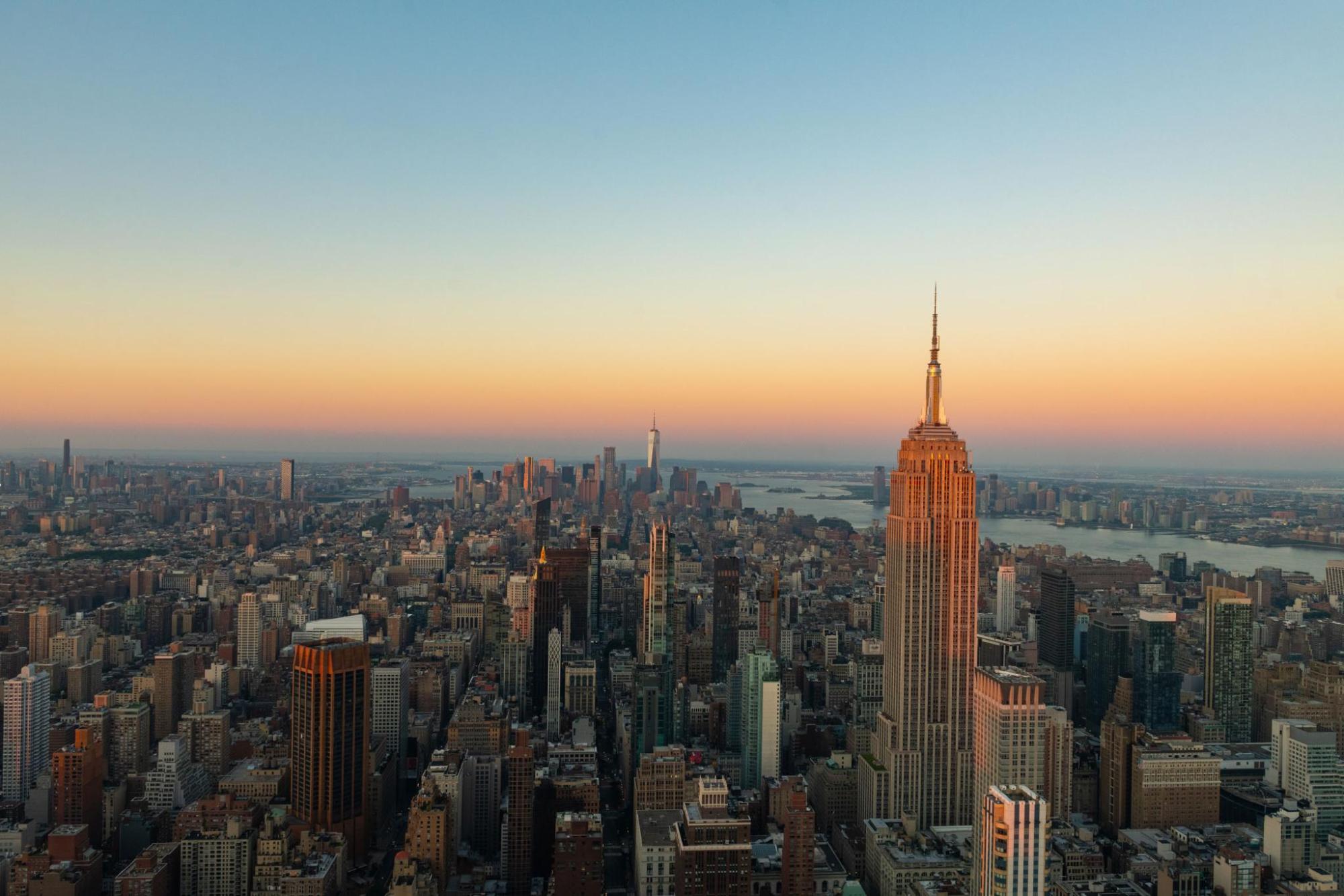 New York skyline at sunset with the Empire State Building and Lower Manhattan in view