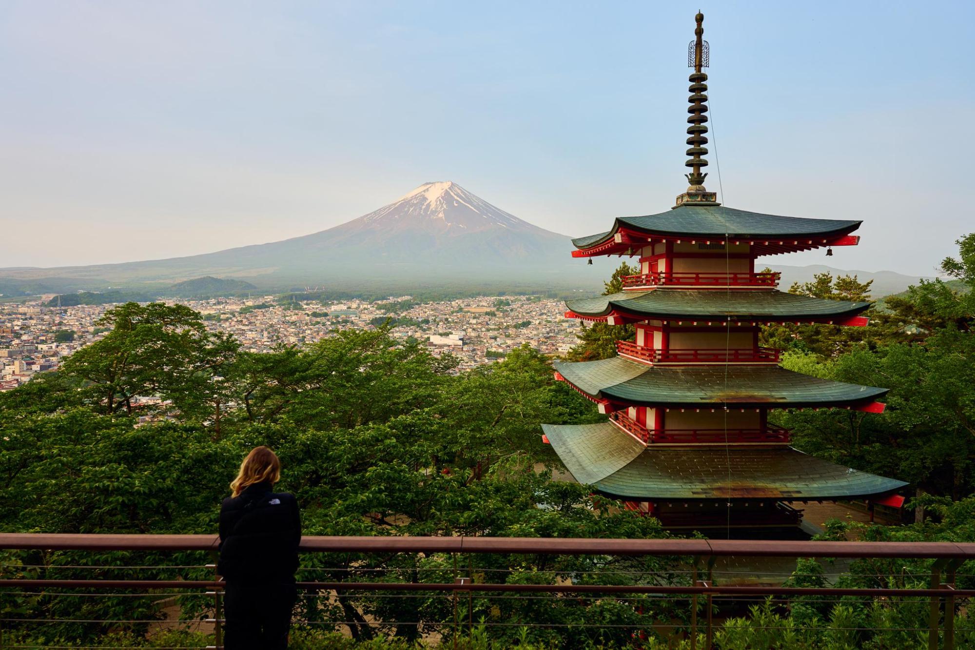 Chureito Pagoda overlooking the city with Mount Fuji in the background.