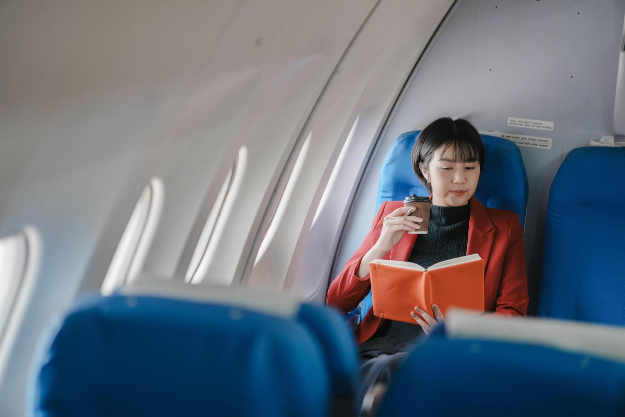 Woman reading on a flight