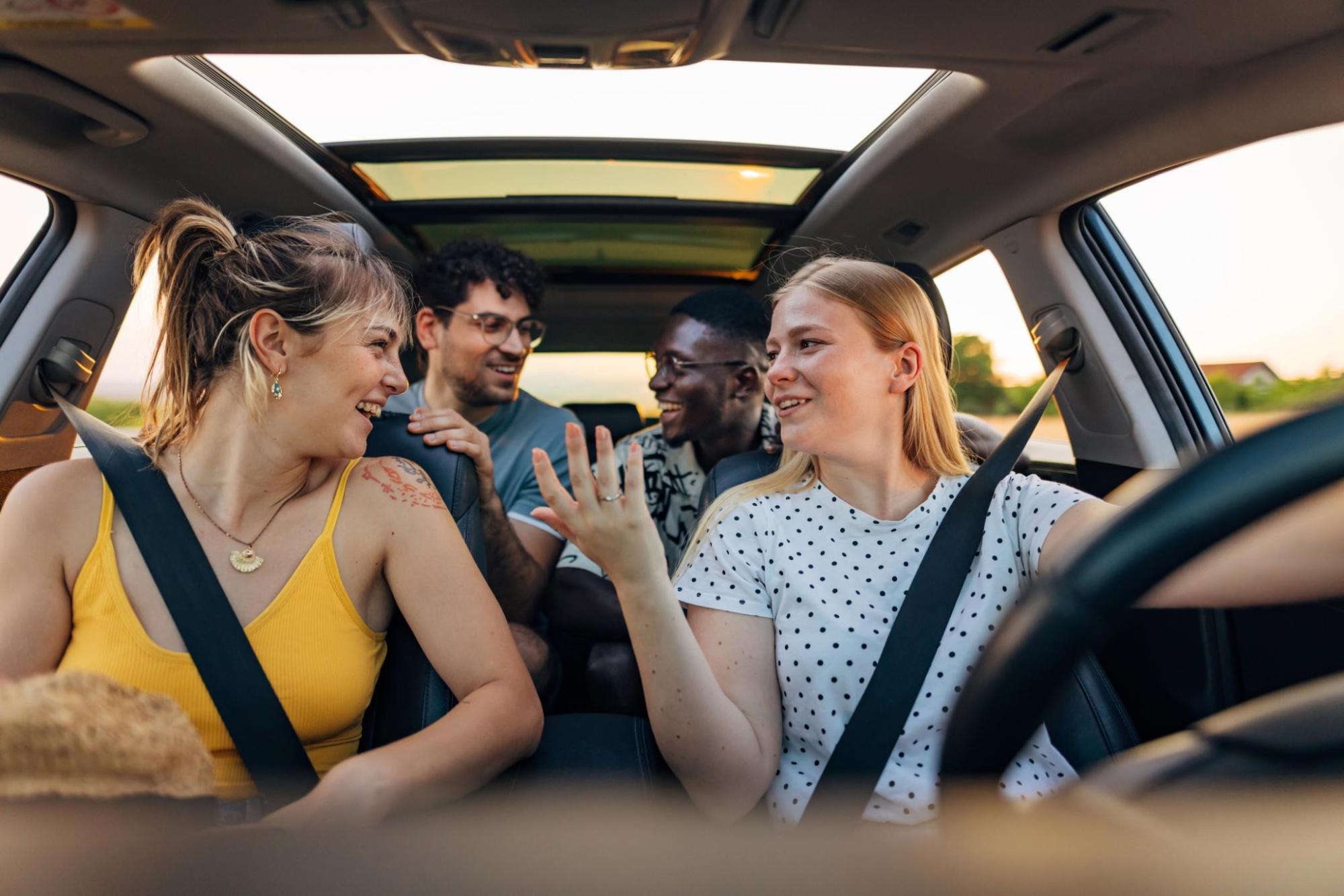 Group of people talking in a car